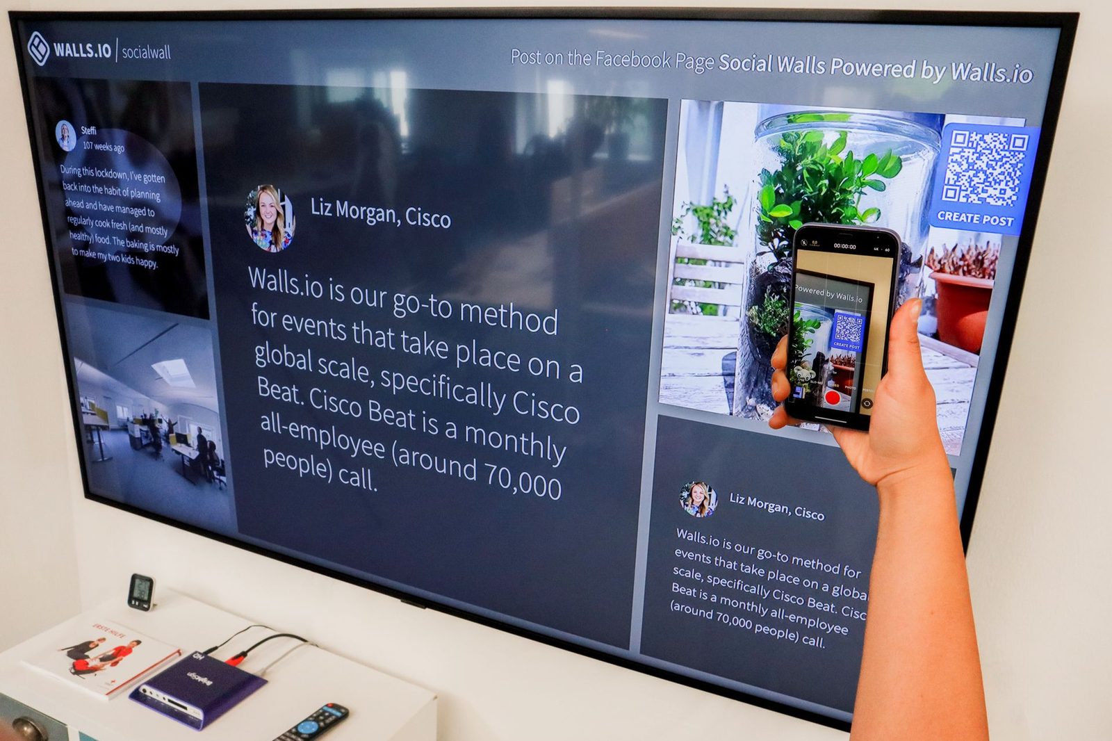 A person scanning a QR code with a phone at an event